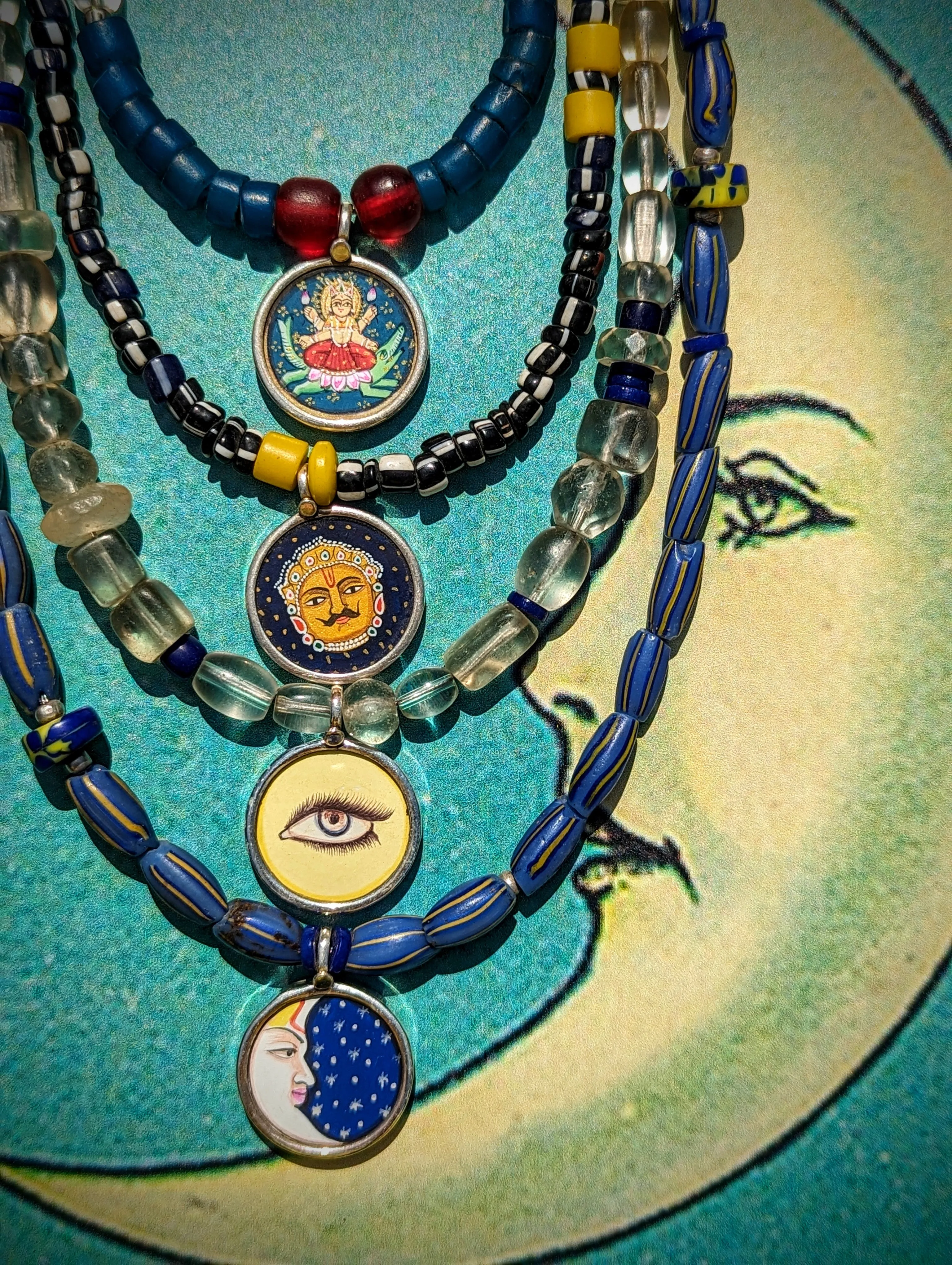 Celestial trade beads with hand painted silver pendants