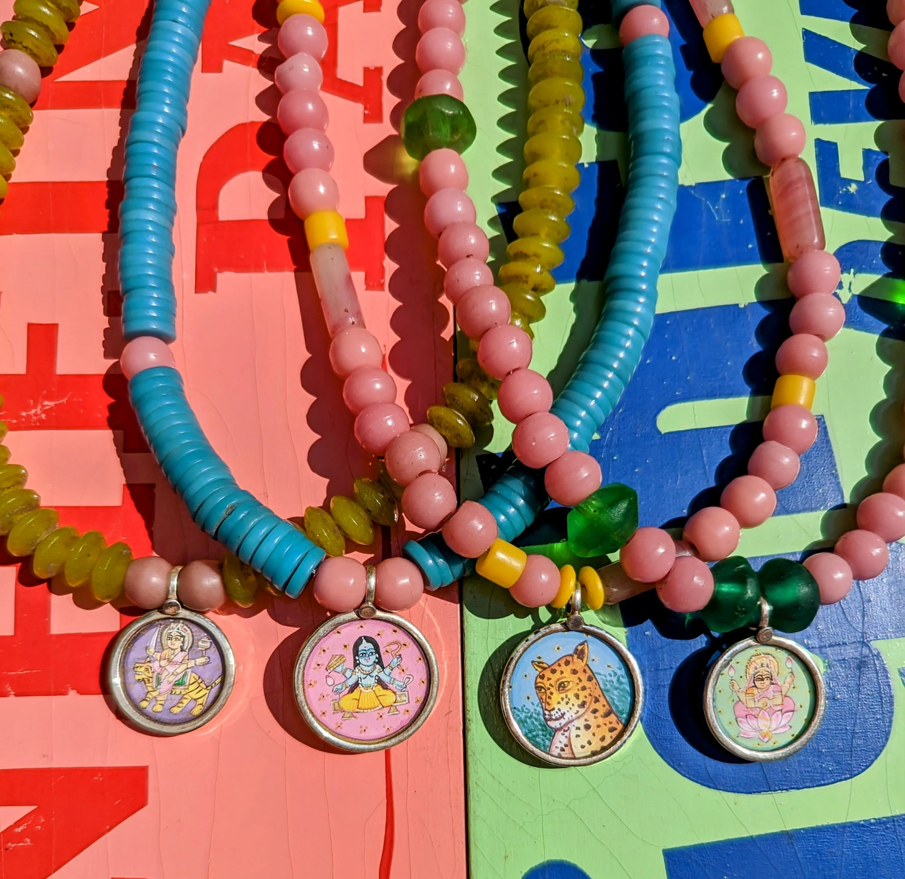 Pastel trade beads with hand painted silver pendants