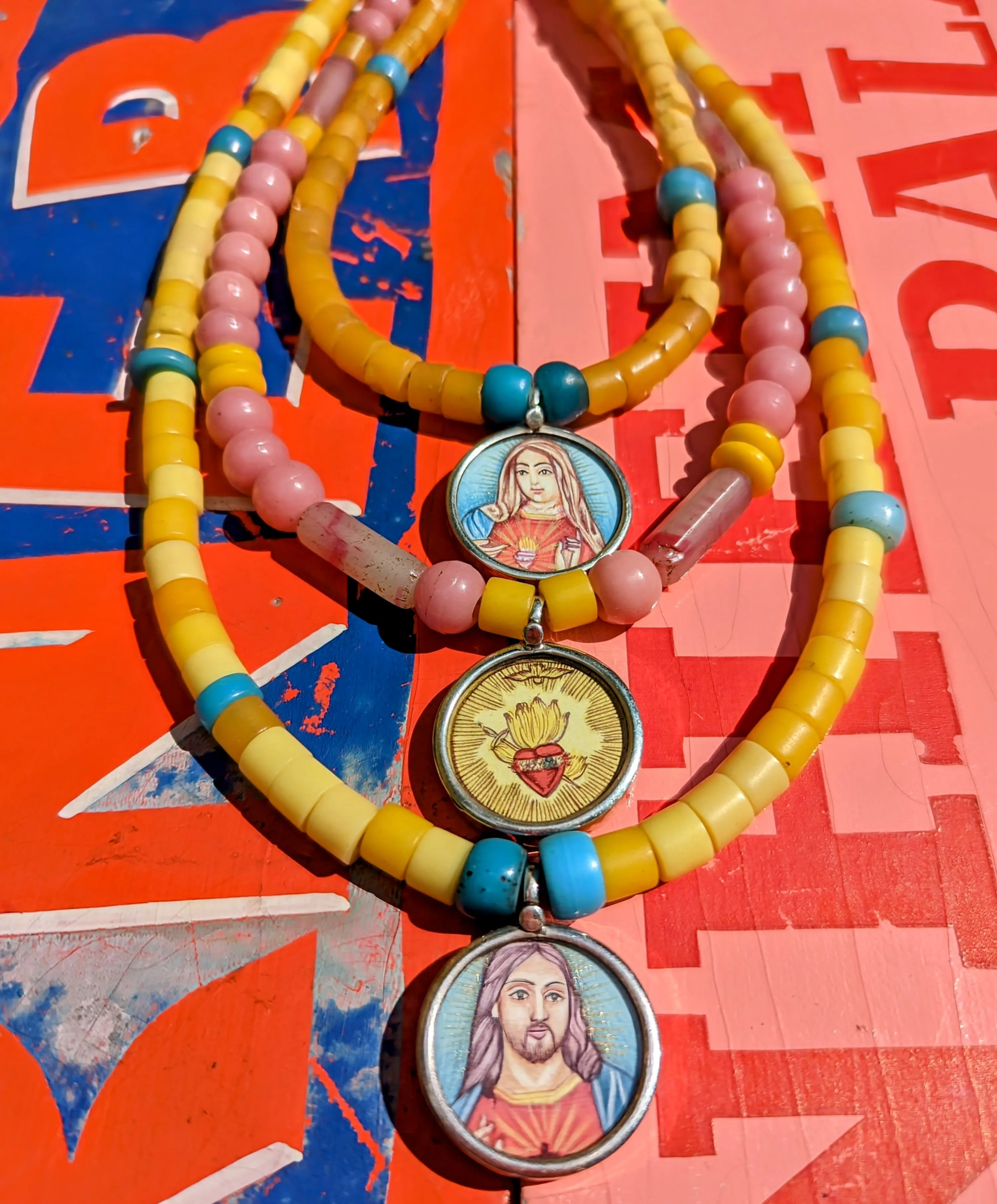 Pastel trade beads with hand painted silver pendants