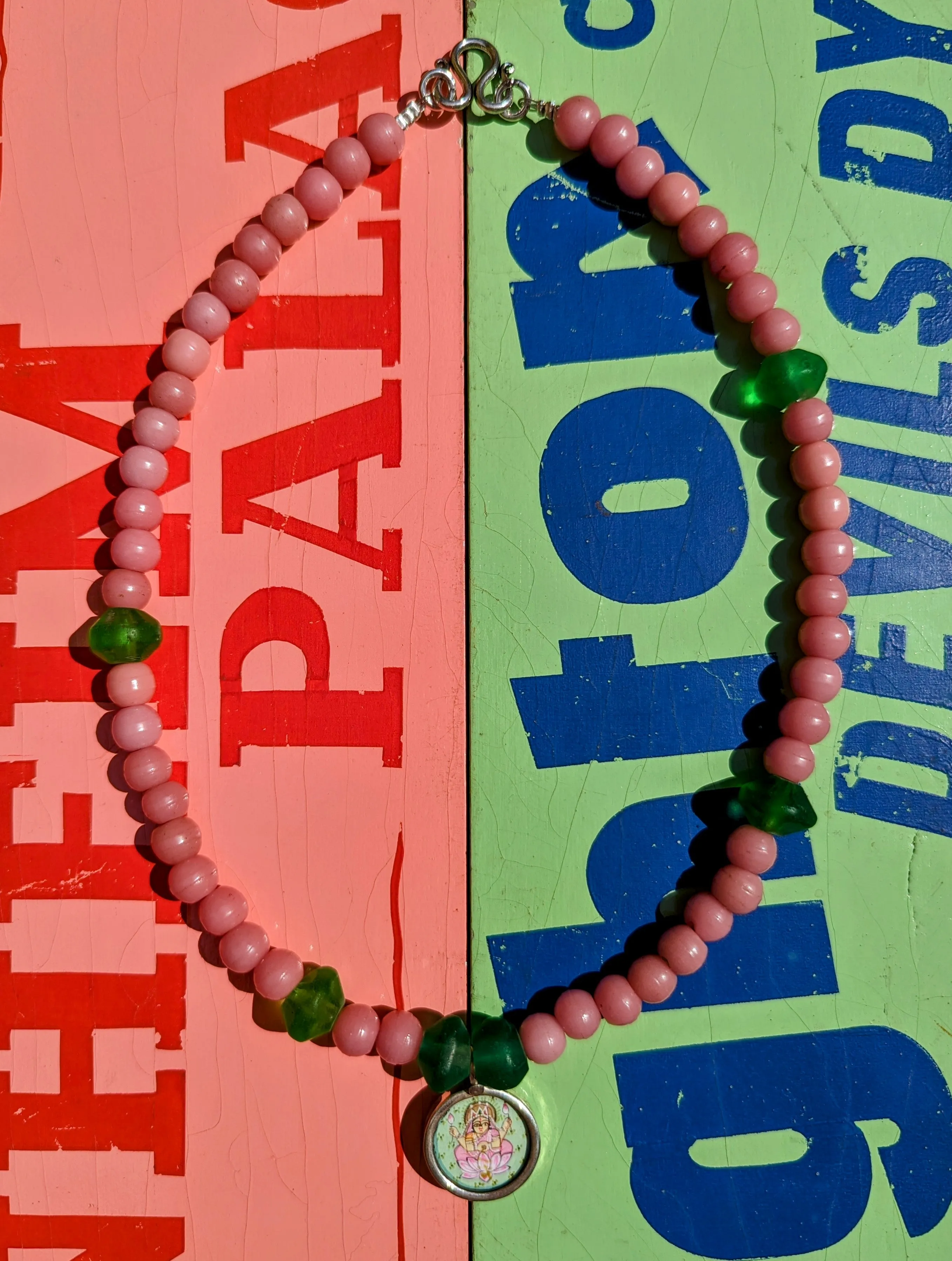 Pastel trade beads with hand painted silver pendants