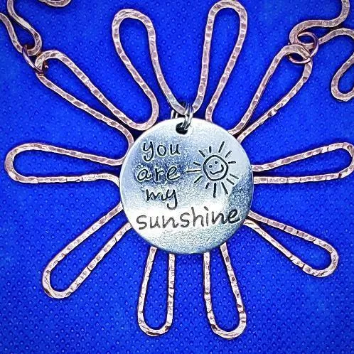 Solid Copper Sunflower Pendant Necklace with Silver "You Are My Sunshine" Charm – Black Leather Rope