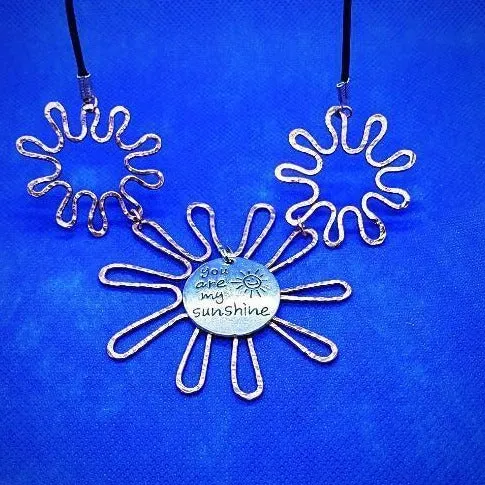 Solid Copper Sunflower Pendant Necklace with Silver "You Are My Sunshine" Charm – Black Leather Rope