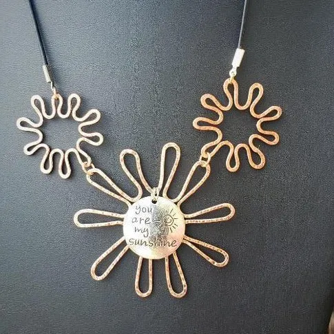 Solid Copper Sunflower Pendant Necklace with Silver "You Are My Sunshine" Charm – Black Leather Rope